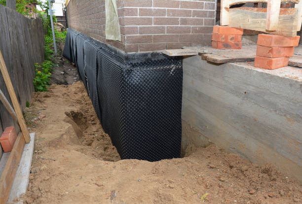 SJ Waterproofing Pros technician performing targeted Waterproofing assessment in Laurel, VA